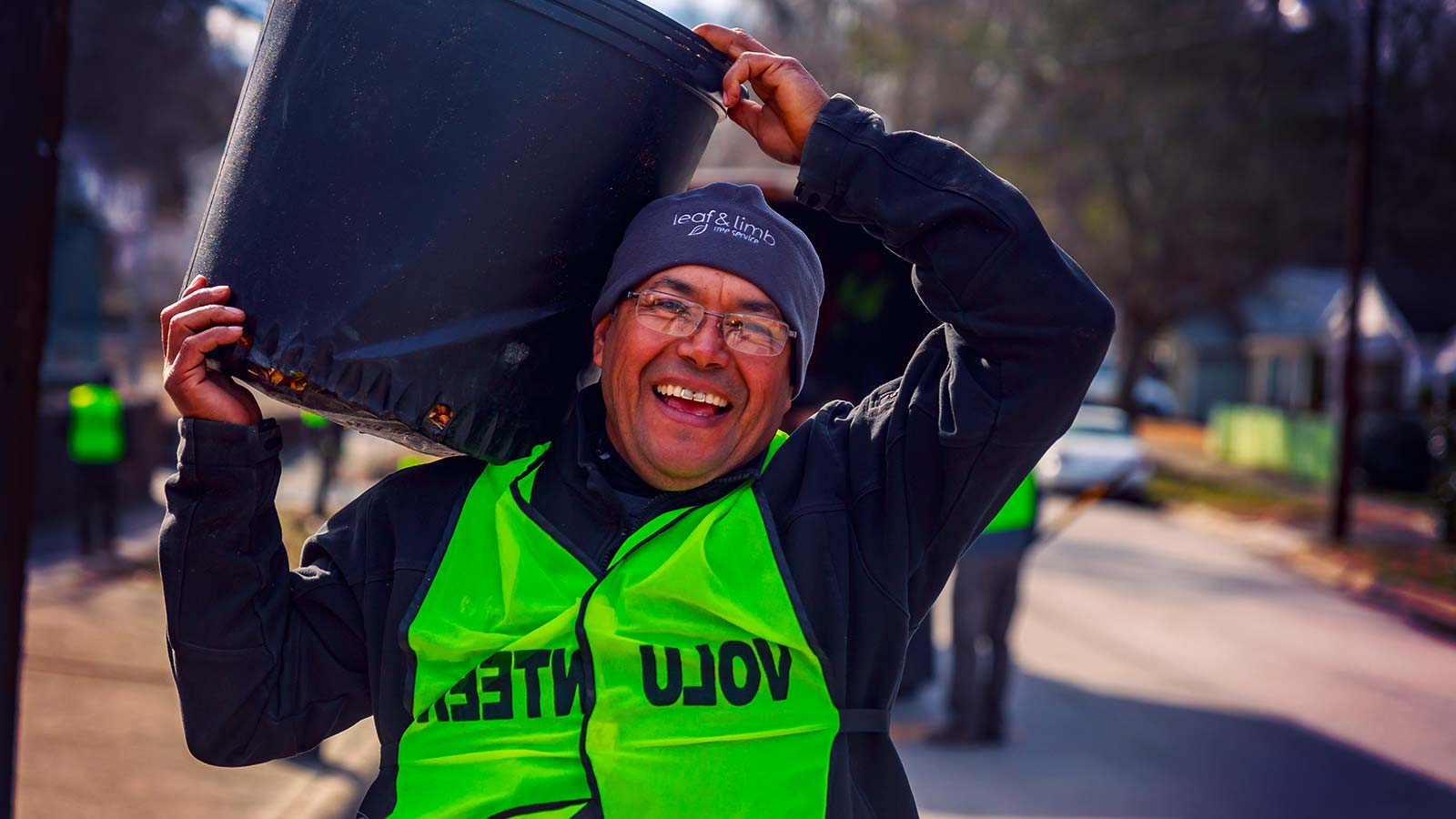 Volunteers planting young trees in a Durham neighborhood